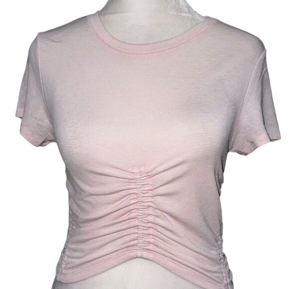 FREE PEOPLE MOVEMENT WOMEN’S TOPS IN SMALL COLOR PALE PINK SHORT SLEEVE NWOT - Picture 1 of 3